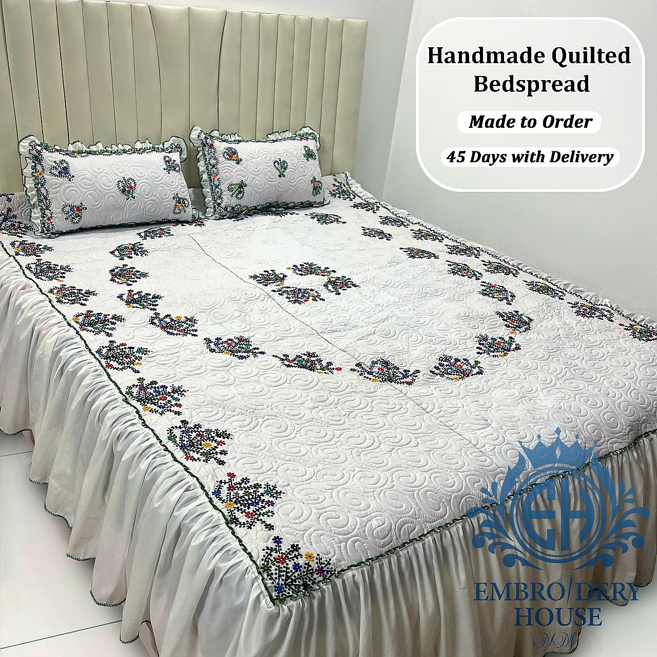 Luxury handmade white embroidered quilted bedspread set with matching pillow covers in Dubai UAE.
