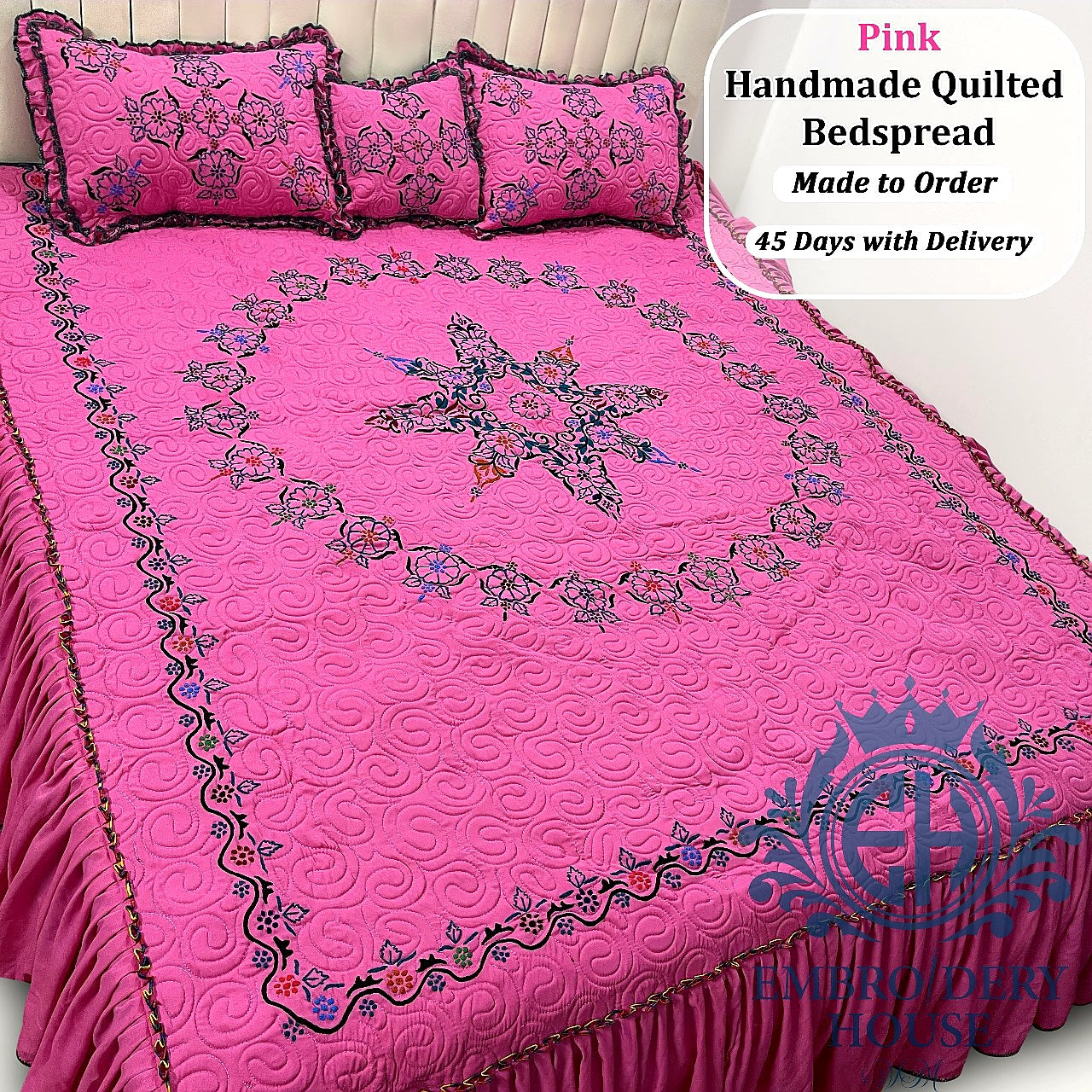 Luxury handmade quilted bedding set with embroidered floral motifs and decorative ruffles.