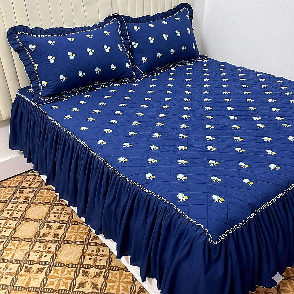 Premium blue floral embroidery bedspread with elegant quilted design for luxury bedrooms.