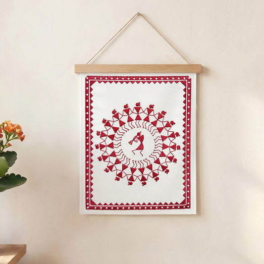 Handmade red textile wall hanging inspired by cultural and tribal embroidery designs.