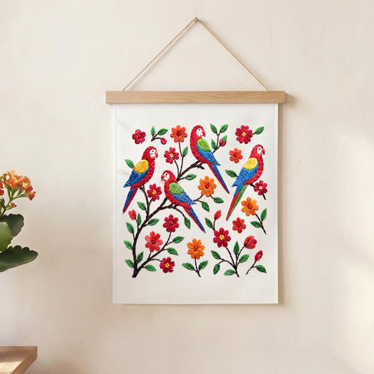 Colorful embroidered parrot and floral textile wall art hanging in a modern UAE home.