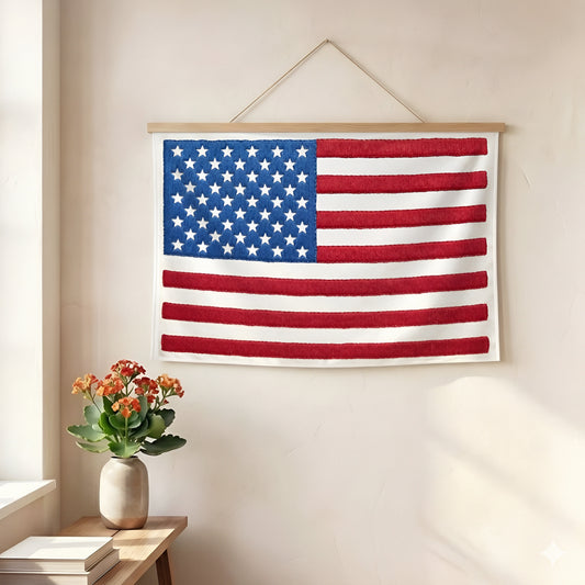 American flag embroidered wall art hanging on wall