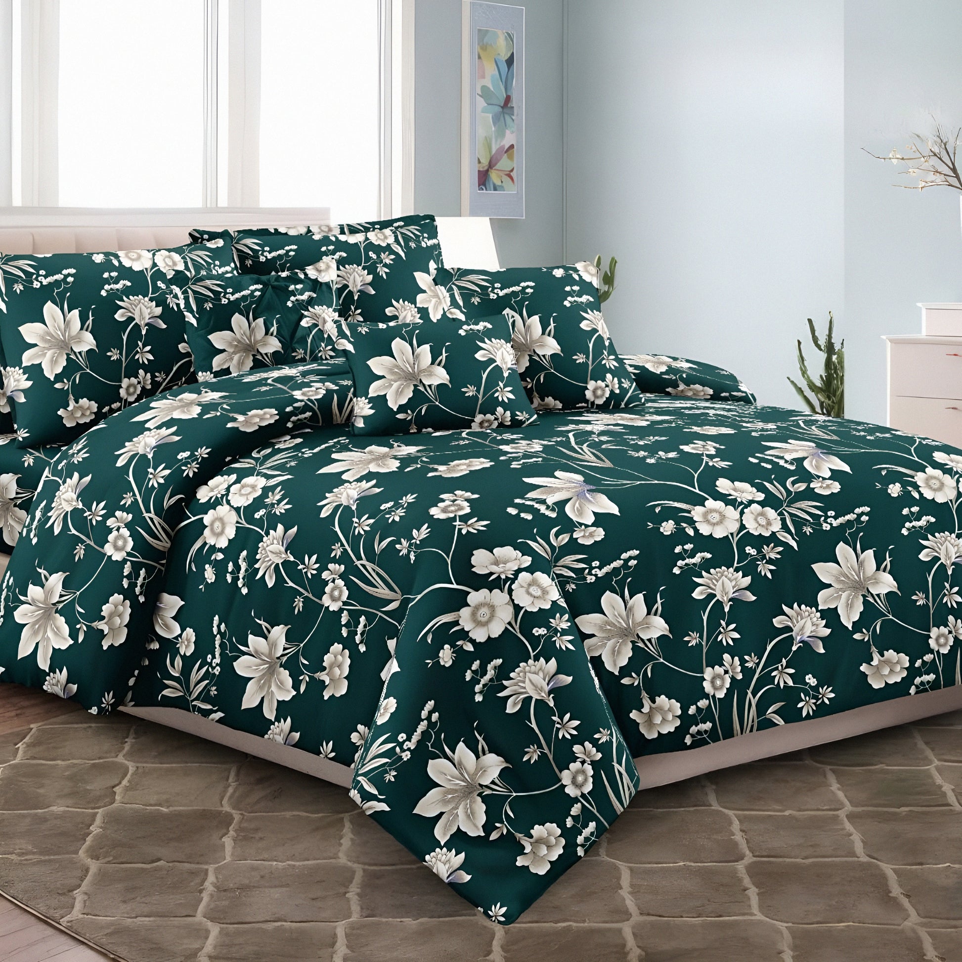 Emerald green floral cotton bedsheet set with white flower print and matching pillow covers styled in modern bedroom.