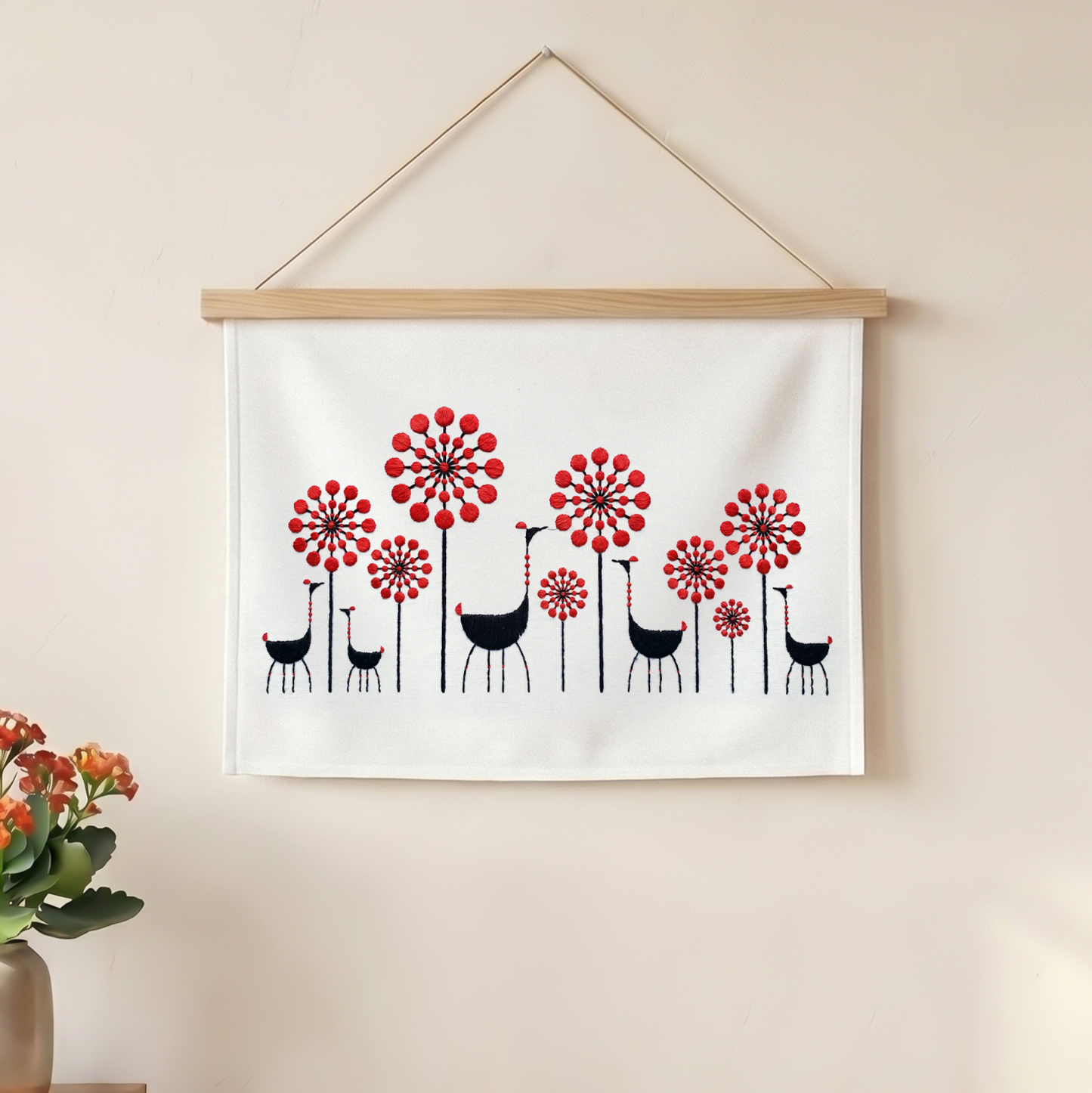Modern textile wall hanging featuring embroidered flowers and birds for home decor.