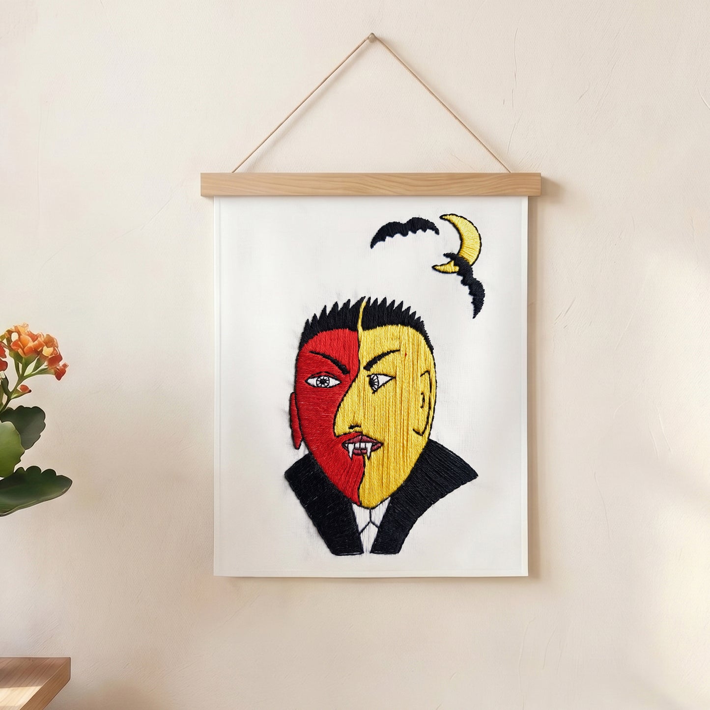 Modern vampire embroidery wall art with bat and moon design on textile fabric