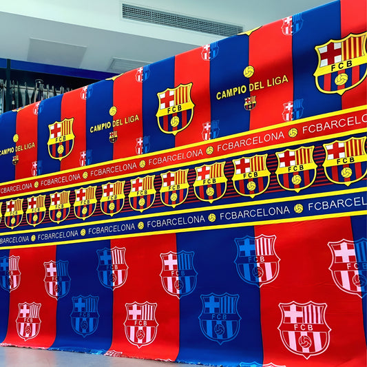 FC Barcelona-themed bedsheet in team colors with crest-inspired motif, neatly styled on bed for fans.