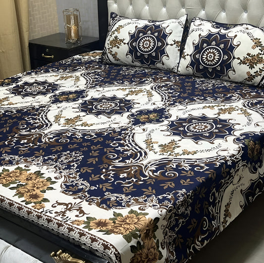 Luxury navy blue bedsheet with gold floral pattern and ornate white detailing.
