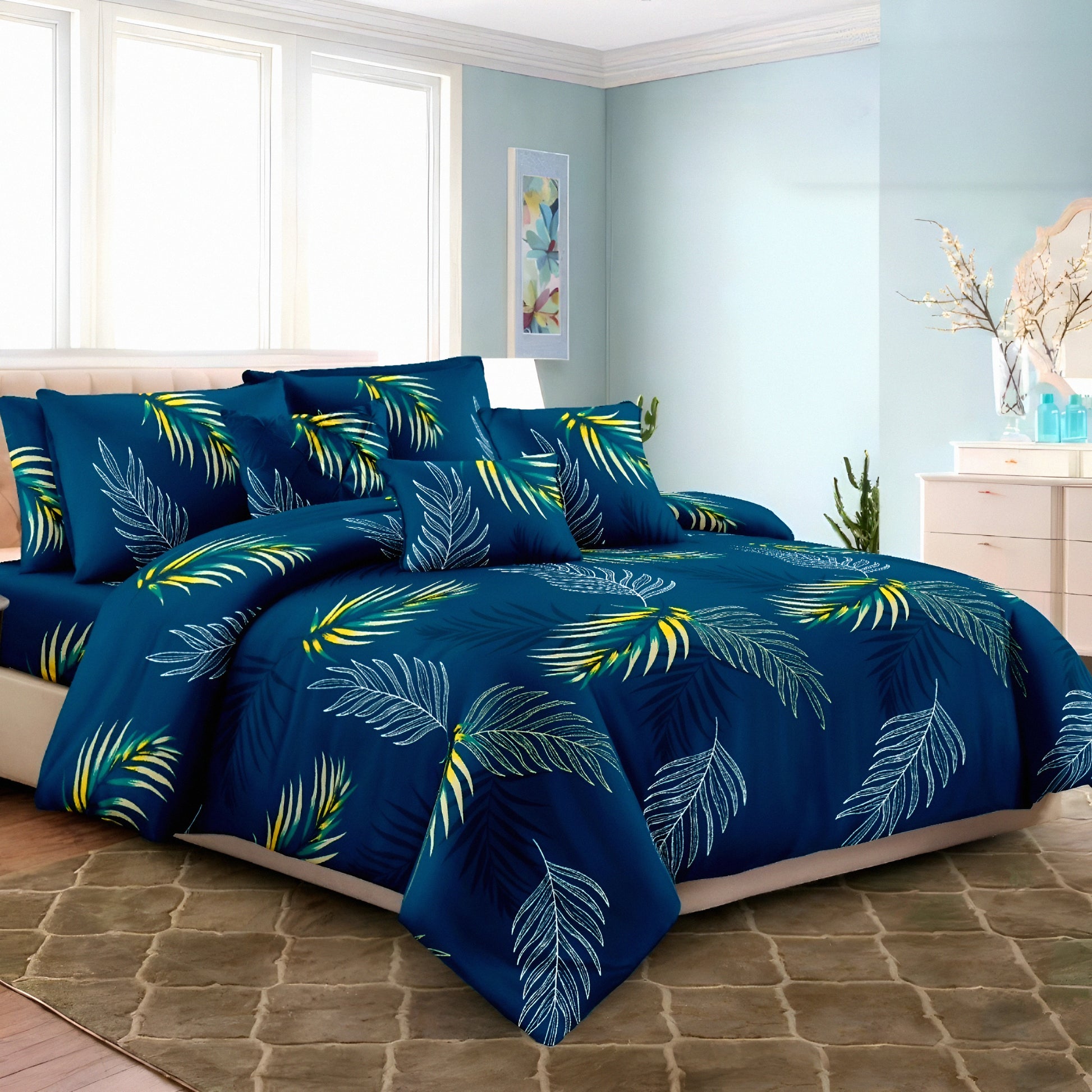 Navy bedsheet set with palm leaf print on a styled modern bedroom bed