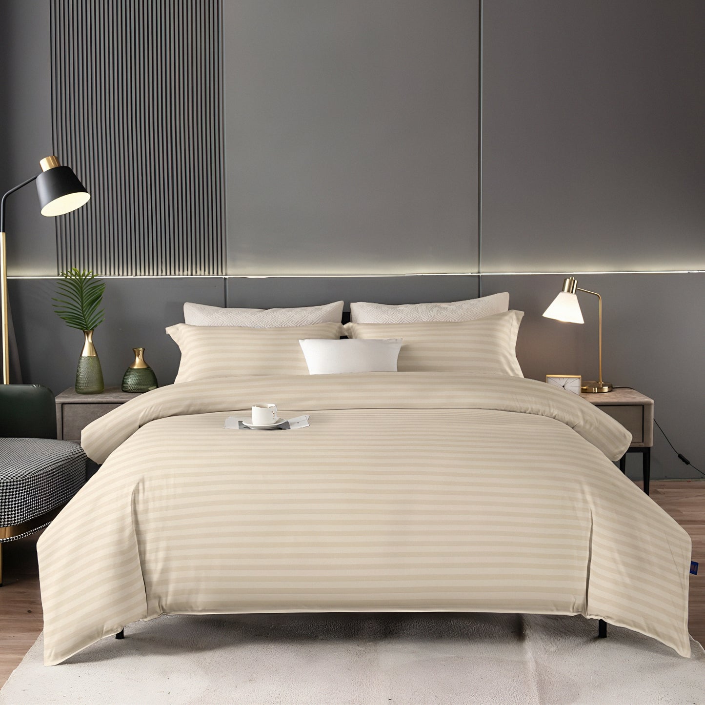 Beige comforter set on a bed in a modern bedroom with gray walls and decorative elements.